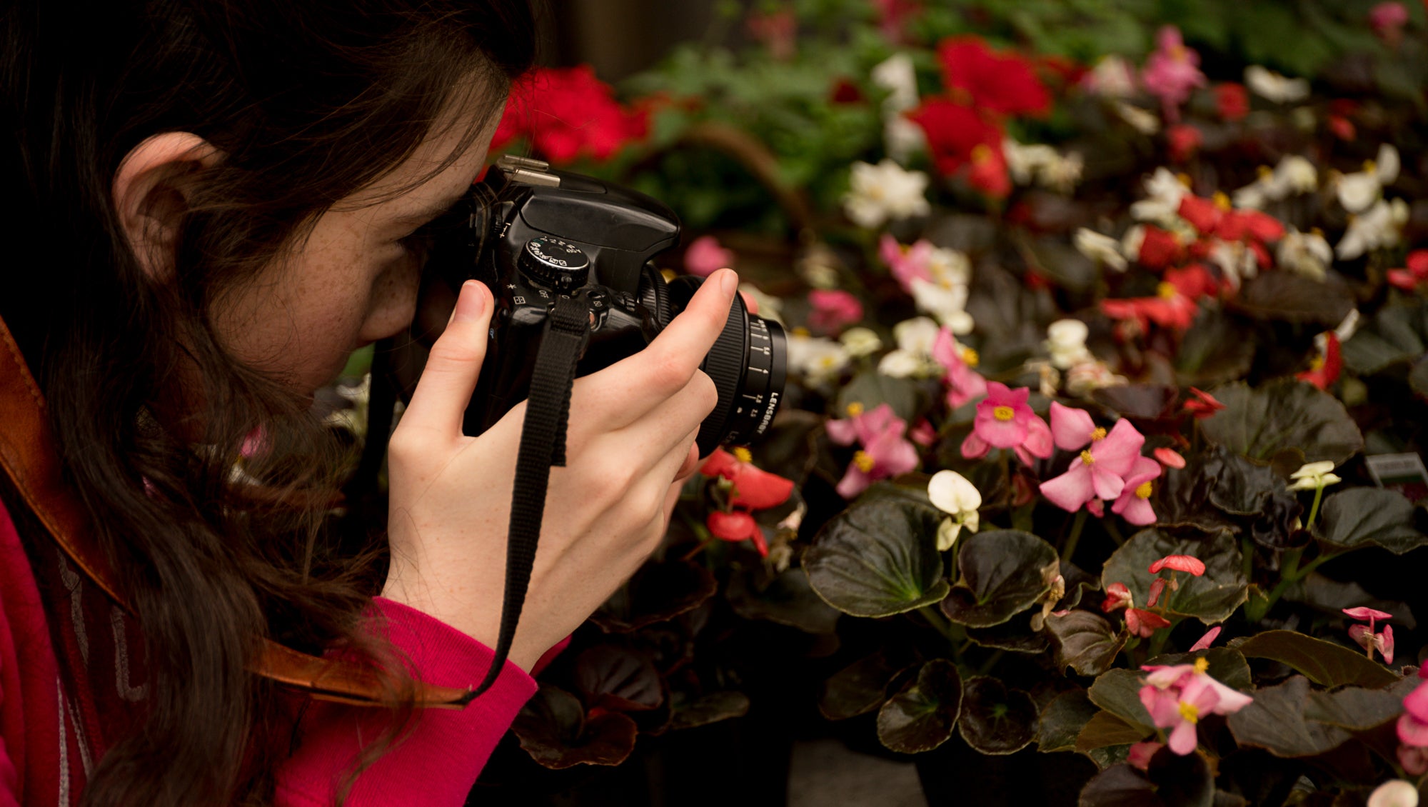 girl taking photos of flowers pink white and red photos Amy Cyphers Photography Adventures