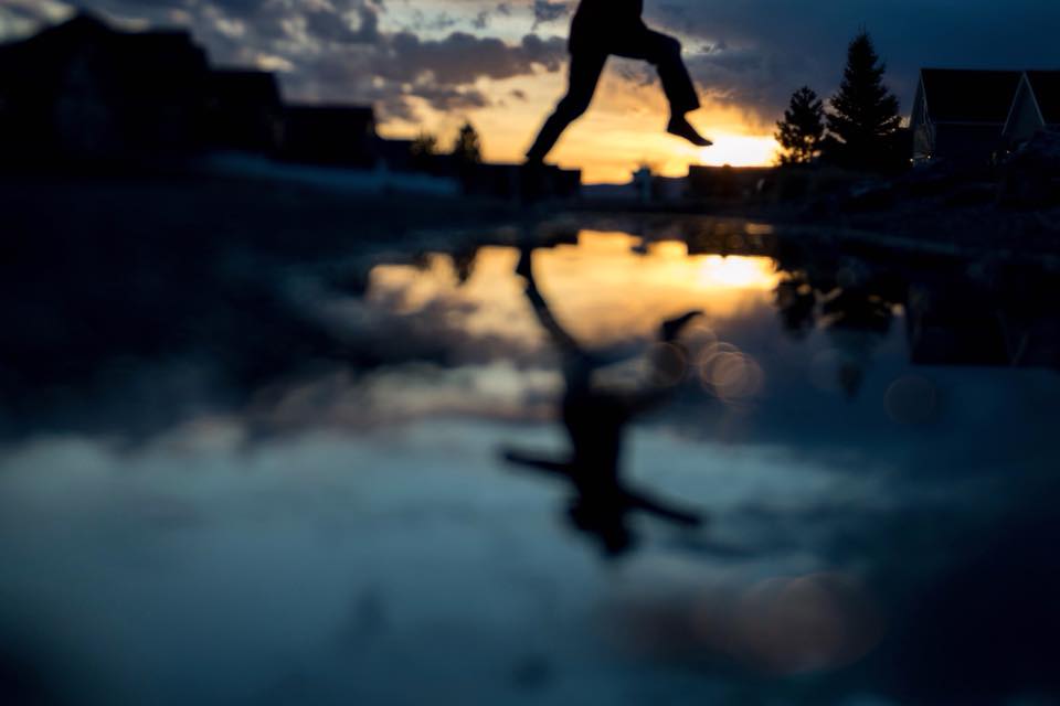 silhouette feet and legs jumping puddle sunset play reflection blue hour lensbaby featured photos