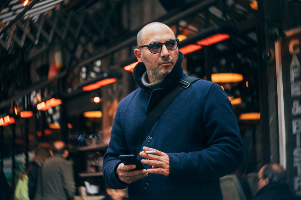 Man with phone and cigarette in paris city bald man with sunglasses Ute Reckhorn Paris Twist 60